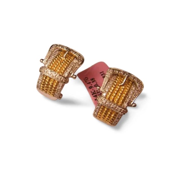 Estate 14K two-tone gold earrings featuring brilliant round diamonds in a buckle-inspired design. Finished with secure...