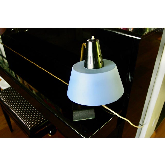 Table or desk lamp from the renowned German firm, brass arm, cast iron base, adjustable pastel blue lampshade, in very...