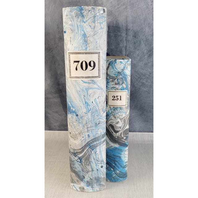 Paper Mache hand painted marble book boxes in Tiffany Blue and Gray. Boxes are distressed and have blue ribbons to tie...