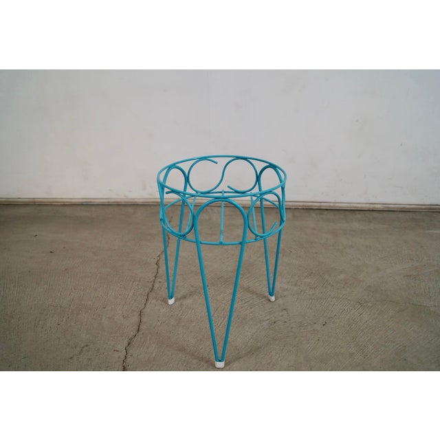 Vintage 1960's Mid century Modern plant stand for sale. It was manufactured in the 1960's, and is made of metal. It has a...