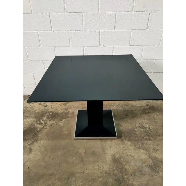 Table made of wooden sheets with a steel frame. Measurements: height 75cm, width 100cm, depth 100cm. Weight: 50kg.