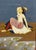 The figure is depicted in a contemplative pose, gazing upward towards a crescent moon silhouetted against a deep cobalt...