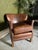 A handsome traditional armchair handcrafted in 100% genuine Brazilian leather, combining classic proportions with the rich...