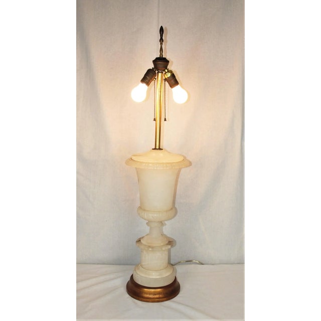 A vintage mid-century marble lamp. Shape is an urn resting on a pedestal. Measures 37” high to top of finial and 20” to...