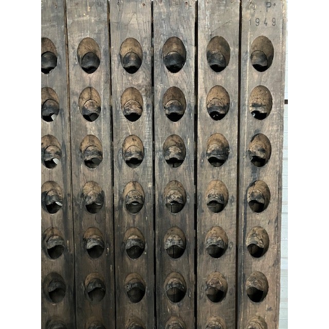 Our vintage French Riddling Rack is from the vineyard "Vignerons de la Champagne," “v.p 1949” which is associated with the...