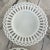 Collection of four vintage beautiful milk glass plates - each with its own unique fretwork and articulated glass pattern....