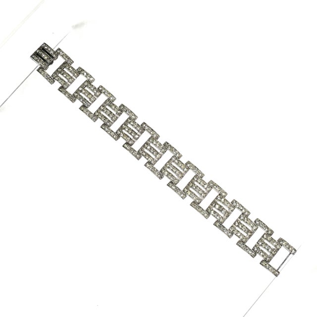 Vintage Art Deco rhodium-plated crystal bracelet. Geometric links alternating between three-row segments and double side-...