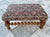 Antique solid wood stool with cushioned tapestry top and bobbin turned legs. Tapestry is a colorful green, red & pink...