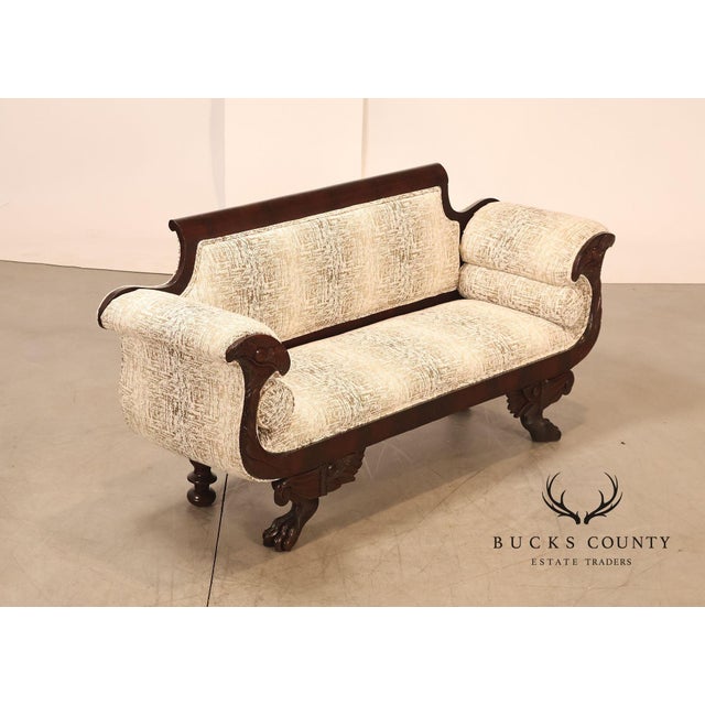 Vintage American Empire Style Sofa Featuring A Richly Finished Mahogany Frame With Elegant Scroll Arms And Classical...