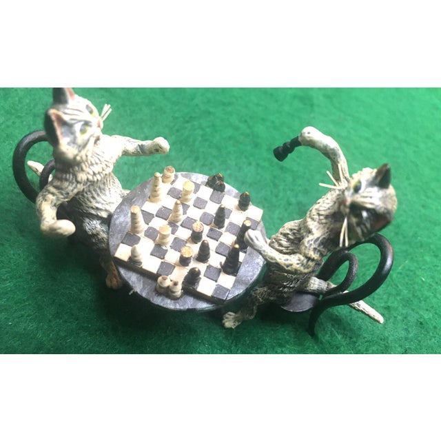 Expertly crafted in the tradition of Austrian cold-painted bronzes, this whimsical Vienna bronze tabby cat couple are...