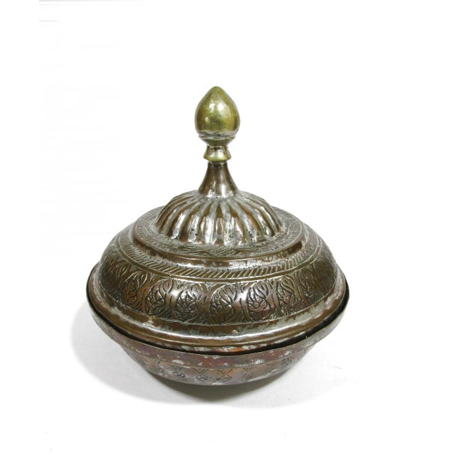 This antique tinned copper bowl from 19th-century Beloochistan (Balochistan) is a testament to Islamic artistry. Crafted...