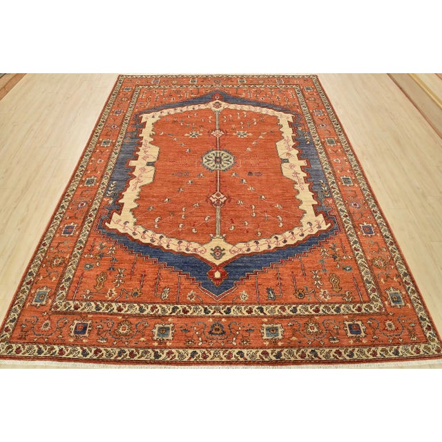 This traditional tribal Ziegler rug is hand-knotted with an all-wool pile on a cotton foundation. This rug is new and in...