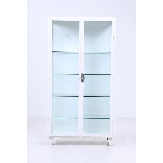 Wonderful large vintage medicine cabinet from the 1940s High-quality workmanship * 4 glass shelves * Material: iron, glass...