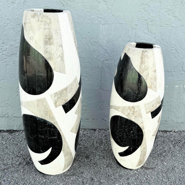 Smaller: 10.5”w, 25”h A striking pair of Postmodern tessellated stone floor vases showcasing bold abstract inlaid designs...