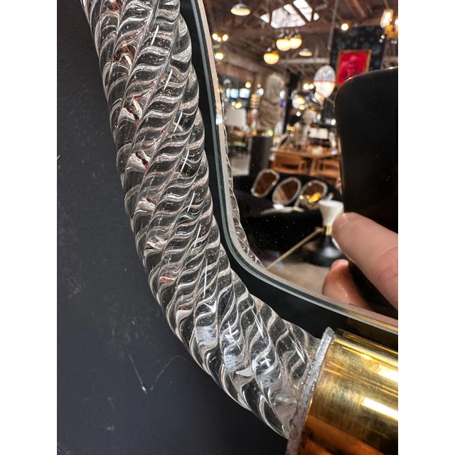 Elevate your space with our Vintage Italian Mid Century Murano Wall Mirror from the 1940s. This exquisite piece boasts a...