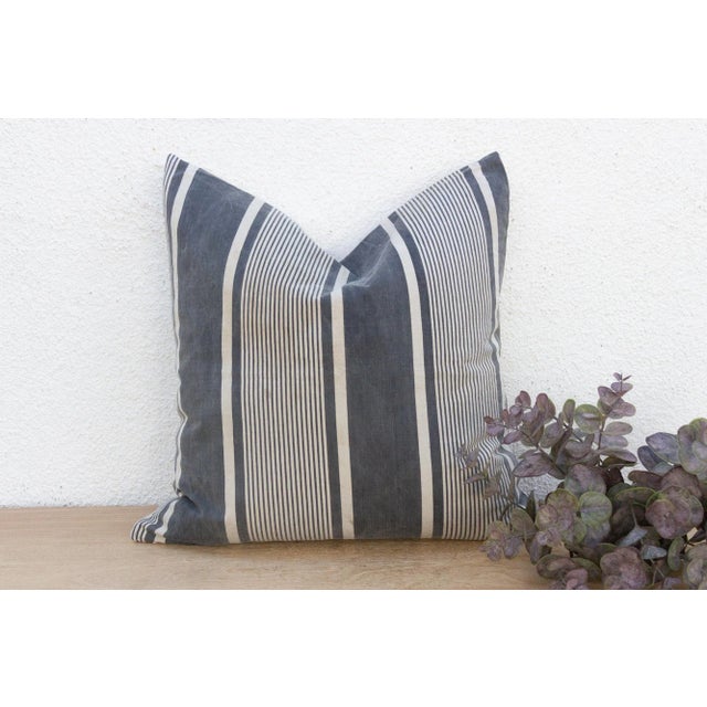 This striking decorative pillow is defined by its bold graphic contrast and rich texture. This 20-inch square pillow is...