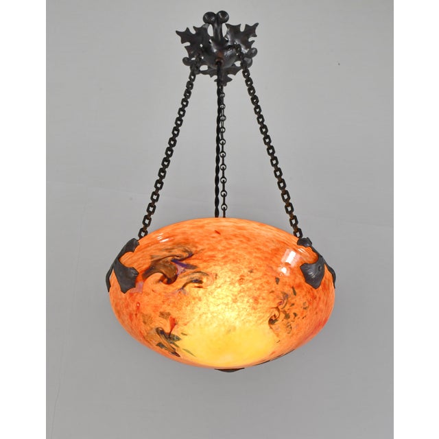 Charles Schneider - Le Verre Français A small and very rare French art deco hanging fixture in wrought iron with a nice...