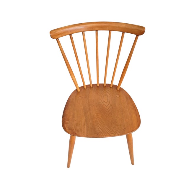 Beautifully Restored Set of 4 Ercol Model 449 Mid-Century Dining Chairs in Solid Elm & Beech A beautifully restored set of...