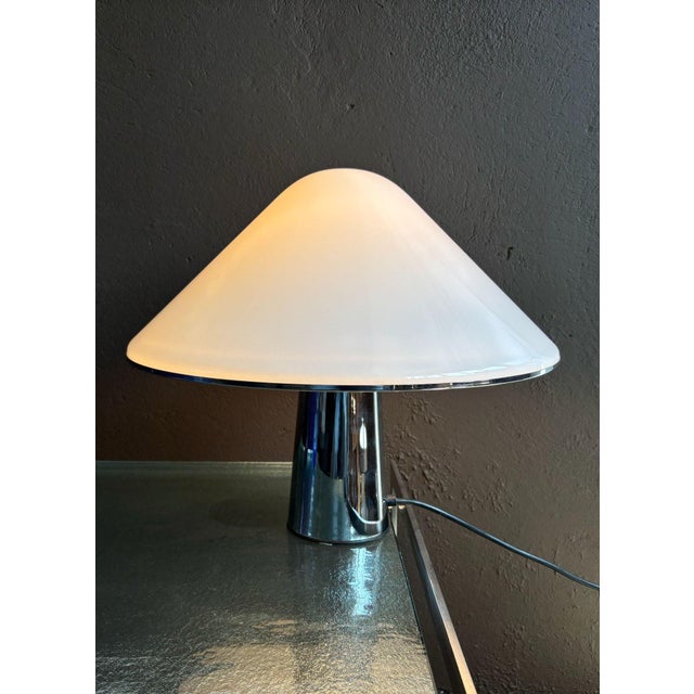 Large and heavy table lamp in very good condition by Italian manufacturer Guzzini, marked as such. This piece has an...