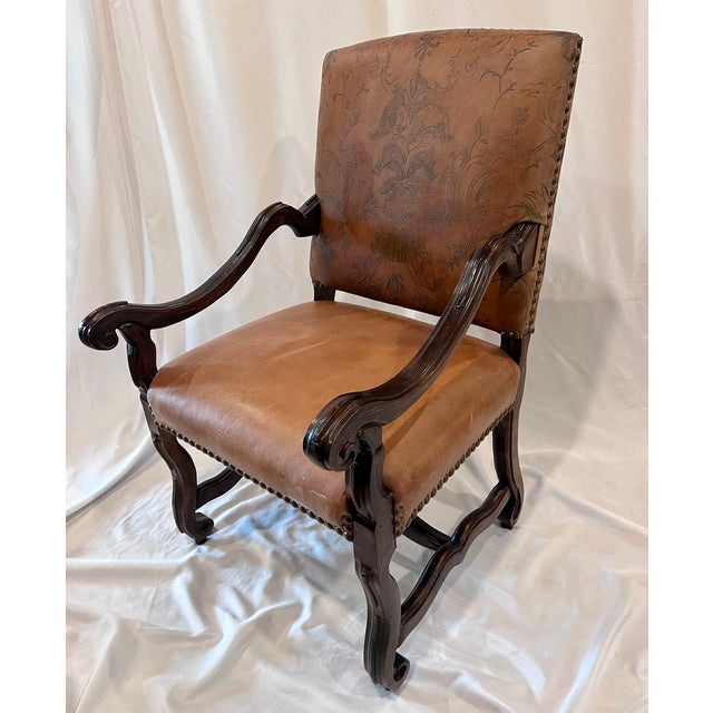 Bring a touch of Old World elegance to your space with this striking 20th-century revival Louis XIII-style armchair....