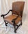 Bring a touch of Old World elegance to your space with this striking 20th-century revival Louis XIII-style armchair....