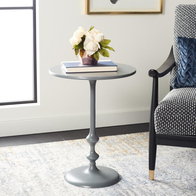 With its contemporary spin on traditional spindle style, this modern side table is a new classic. Its gently sculpted...