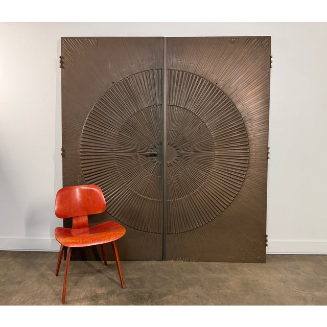 Monumental pair of sculptural architectural double doors by Kaylien of Santee, California, circa 1970. The doors feature a...