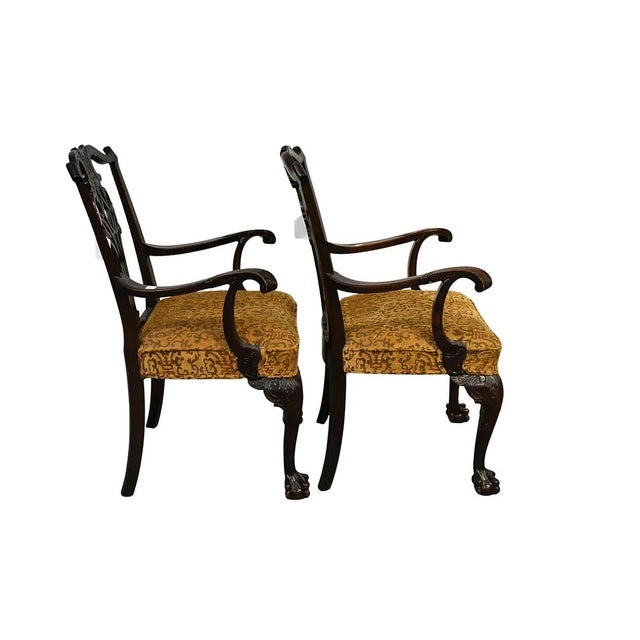 This pair of English mahogany Chippendale arm chairs from circa 1850 is a true antique set that exudes elegance and...