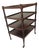 English Regency Style Four Tier Table on Tiny Brass Castors For Sale