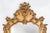 Stunning rococo or baroque mirror in gilted resin, made in Belgium in the 1950s. The ornate design of the frame features...