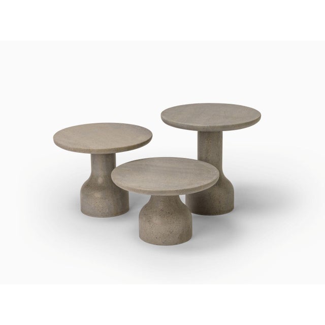 Designed by the Danish duo Depping & Jørgensen, this side table is a refined piece of art carved from solid limestone,...