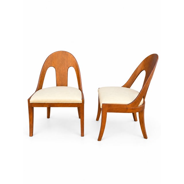 Pair of spoonback chairs. The modern chairs are in good condition. The frames are solid. The upholstery is new, done for...