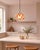 Crafted with high visual clarity, this modern pendant lamp features a sleek silhouette hand-blown from premium glass in a...