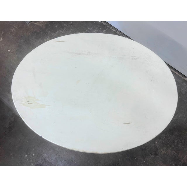 Vintage white painted oval pedestal side table. Restored. Intentional distressed painting. Acquired from an auction in...