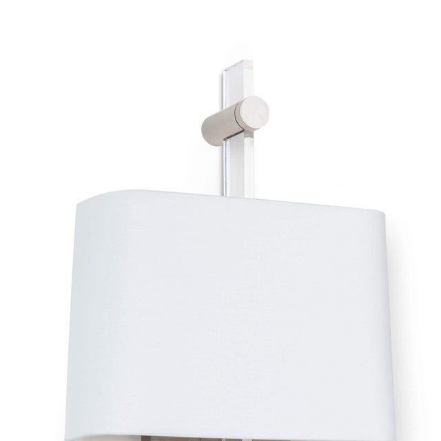 Nothing says modern glamour more than acrylic! The Taurus sconce fuses an acrylic body with metallic accents for a warmer...