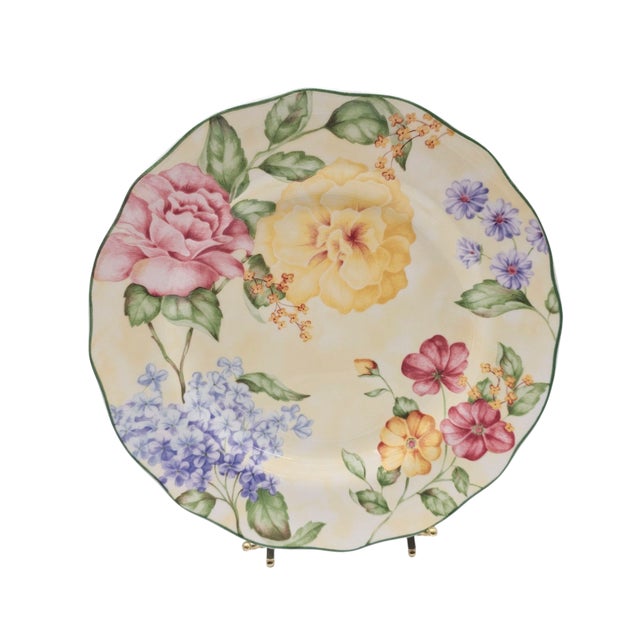 A bouquet of memory pressed into porcelain—soft buttercream fields alive with lilac, rose, and pansy, their bloom forever...