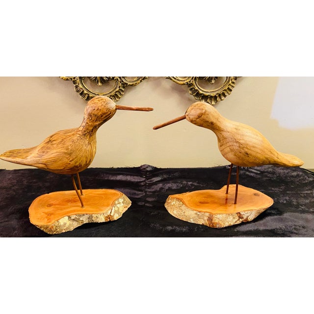 Pair of Hand Carved Walnut Wood Birds. This lovely pair of wood birds features beautiful details and each bird is finely...