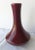 Royal Haeger oxblood bud vase with a low sheen finish, although not completely matte, and a simple and elegant Art Deco form.