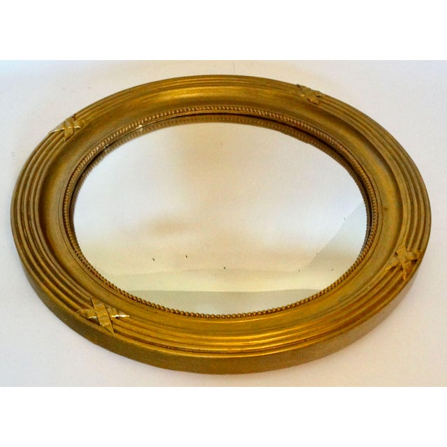 Large English carved giltwood convex wall mirror with a beautiful decorative frame. It is an attractive, heavy mirror with...