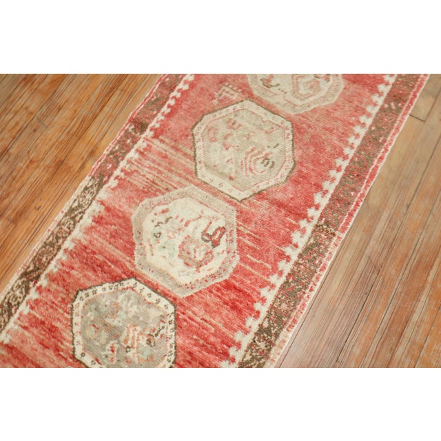 A mid 20th Century narrow and small red turkish runner Details rug no. r5903 size 2' 4" x 7' 6" (71 x 229 cm)