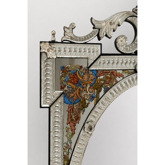 Large Venetian Renaissance-style mirror with a rectangular frame arranged around a central oval beveled mirror, measuring...