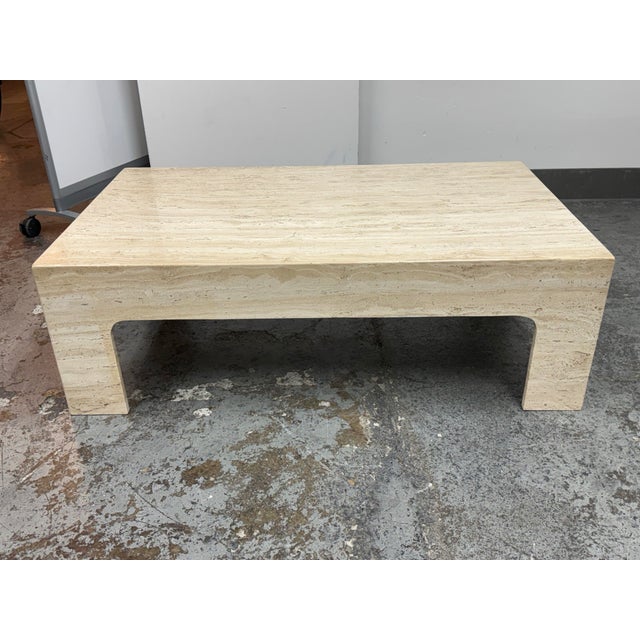 Design Plus Gallery presents a Vintage Italian Travertine Coffee Table. Its rectangular top rests on four integrated legs...