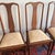 A beautiful set of four early 20th century classic Georgian / Queen Anne style dining chairs featuring elegant shield-form...