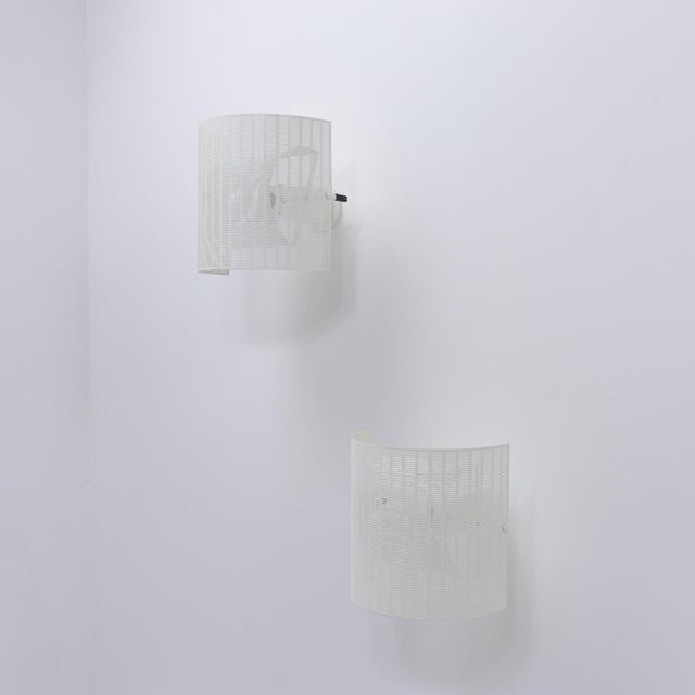 Condition: both lamps have the little adjuster of the inner shade missing. Paint shows discoloration and age, shades are...