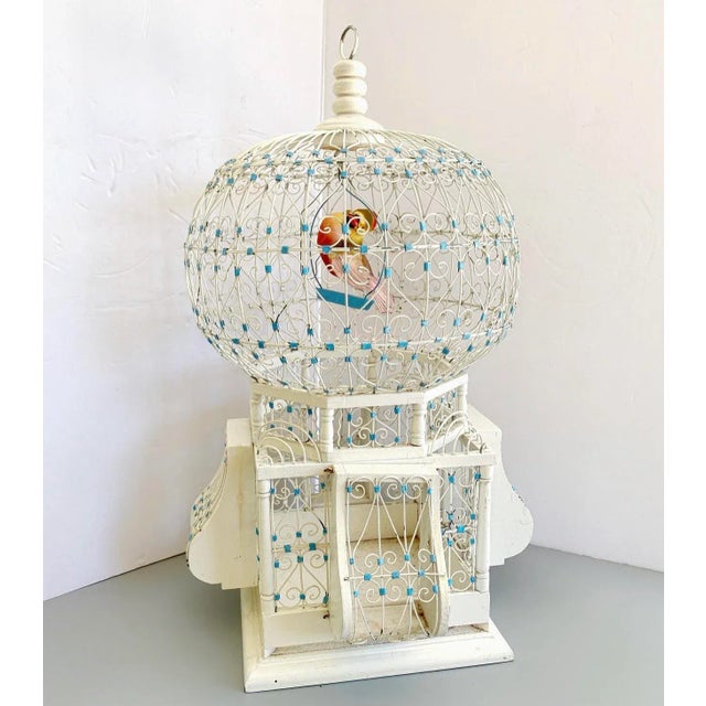 Vintage French Colonial Domed Bird cage with faux exotic bird. Dainty details: construction made of wood and wired metal...