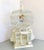 Vintage French Colonial Domed Bird cage with faux exotic bird. Dainty details: construction made of wood and wired metal...