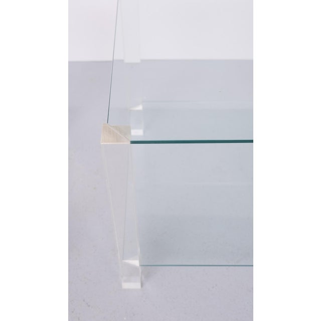 Pair of side Tables, square acrylic glass legs and comes with 8 mm thick safety glass tops , very nice minimalist design ....