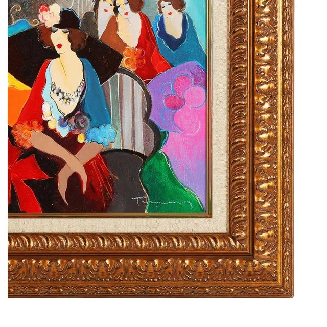 Serigraph in colors on linen with hand embellishment in acrylic paint. Hand signed lower front by Itzchak Tarkay. Hand...