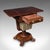 This is an antique ladies hobby table. An English, rosewood drop leaf sewing or parlour table, dating to the William IV...
