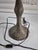 This is an ornate Victorian-style table lamp featuring a scalloped, fabric shade adorned with dense, tiered glass bead...
